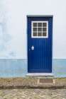 Praia da Vitoria, Terceira Island, Azores, Portugal. Blue door on a building. Art Print